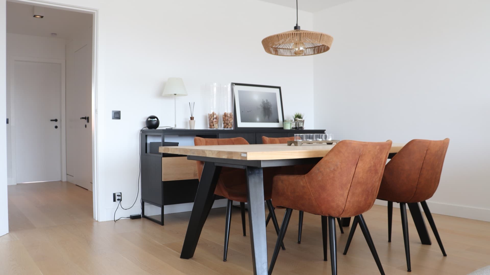 Solid oak dining table with cognac chairs