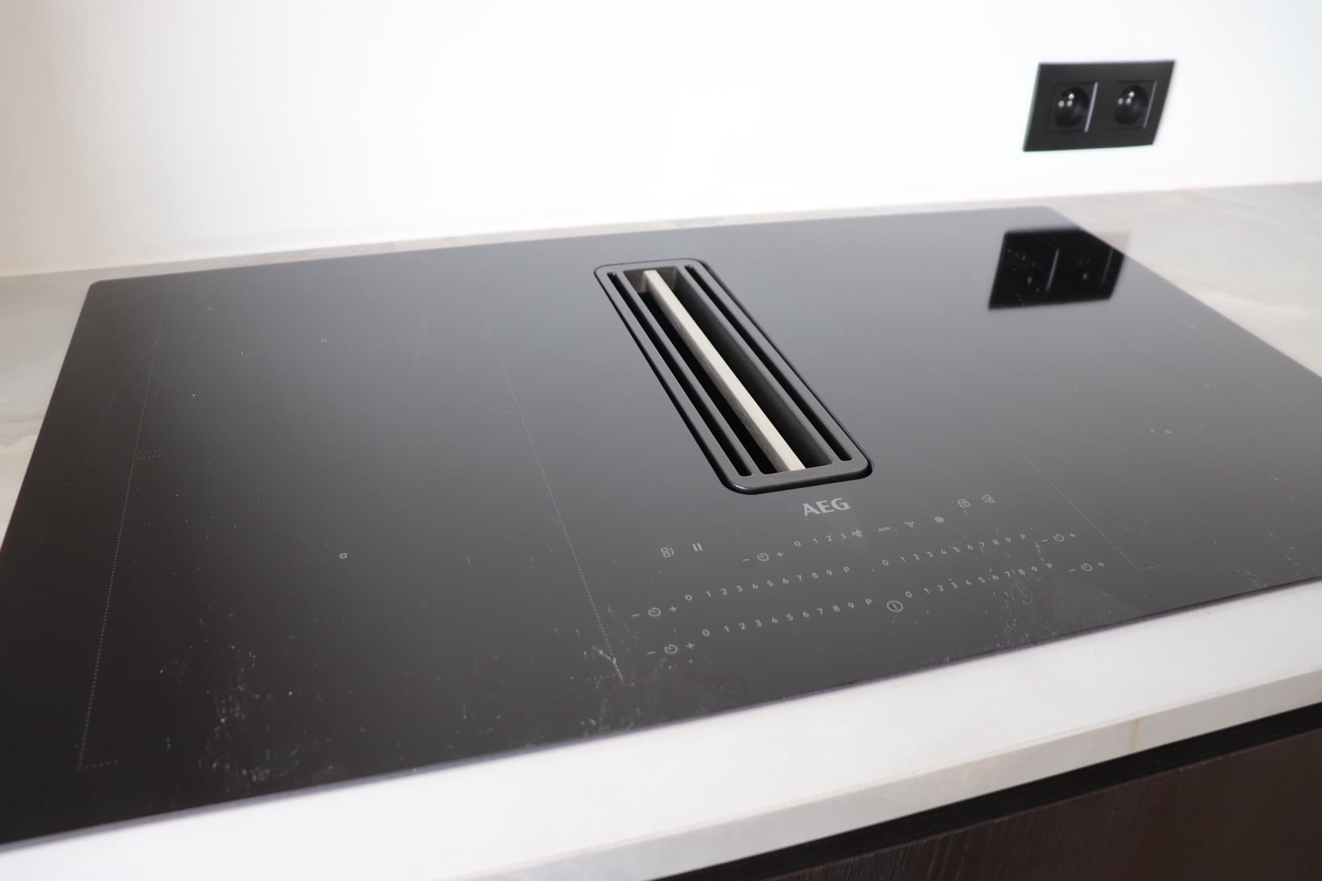 AEG induction cooktop with integrated extractor